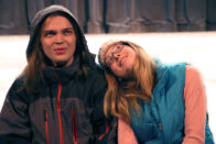 Jacob Reinhart and Emily Hansen sitting together on stage