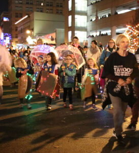 Group of girl scouts walking in the parade