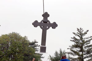Cross being lifted by crane