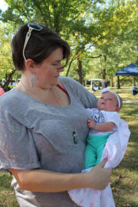 Amanda Simons-Torres holding her baby