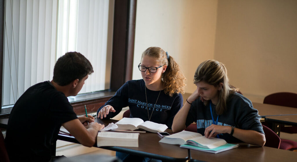 Group of students studying in classroom