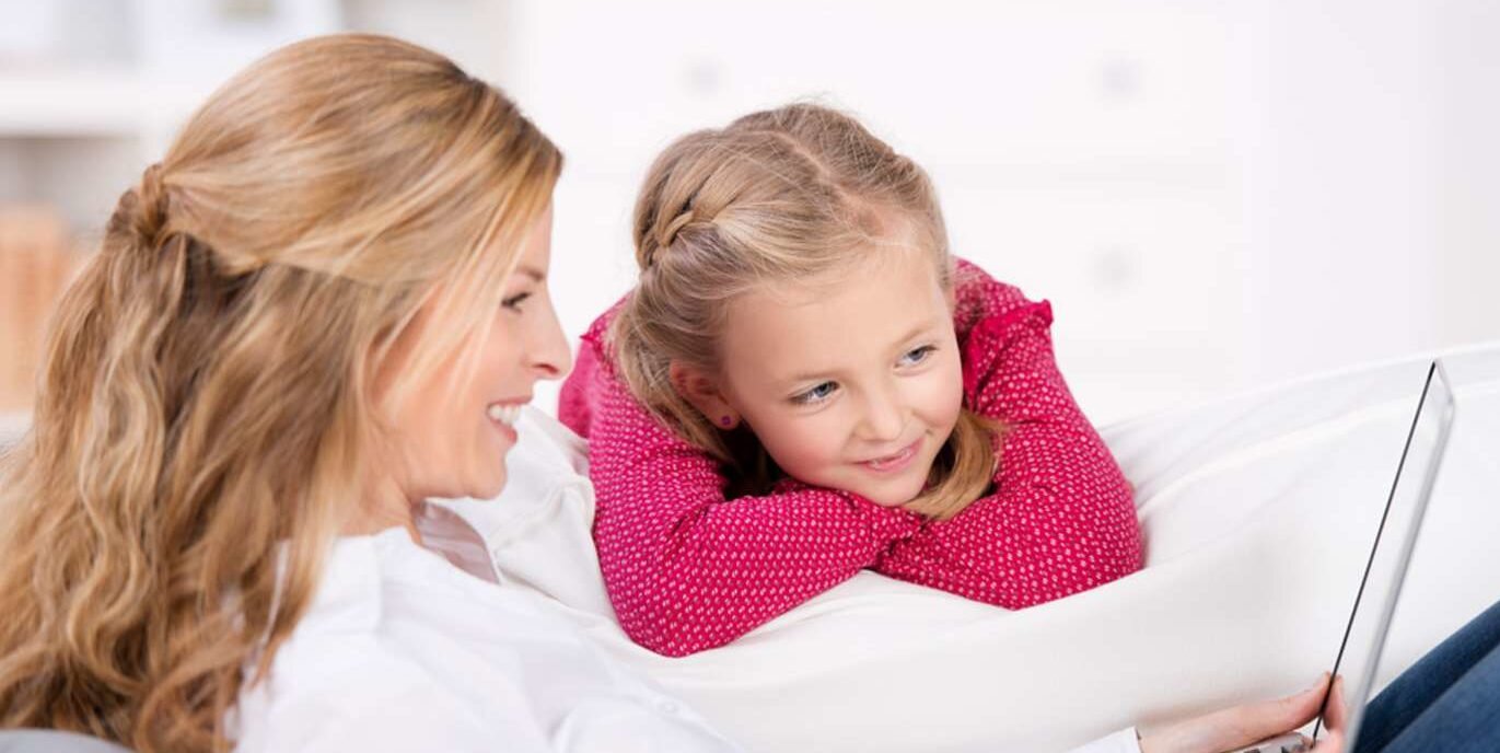 Mom and daughter looking at computer