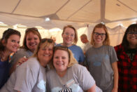 Group of alumni in the Beer & Brat tent at Homecoming 2017
