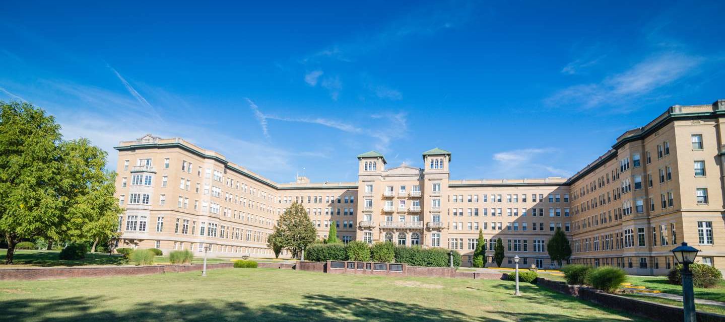 Le Fer Hall with a beautiful blue sky above it.