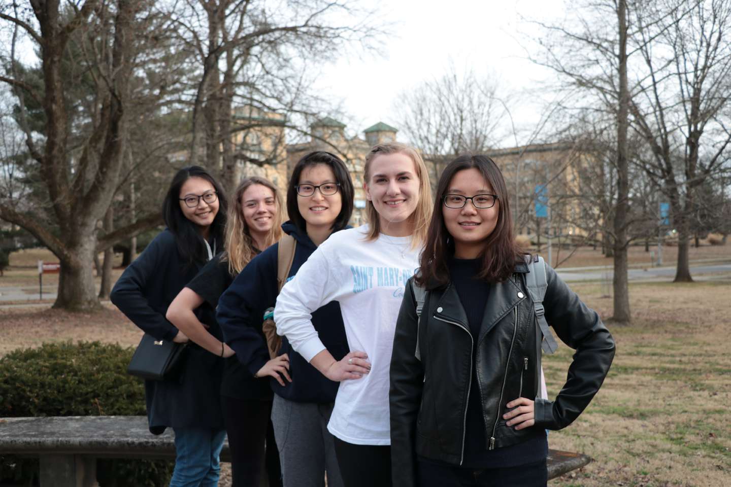 five students outside Library walkway