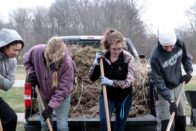 weeding behind Hulman Hall - sustainability