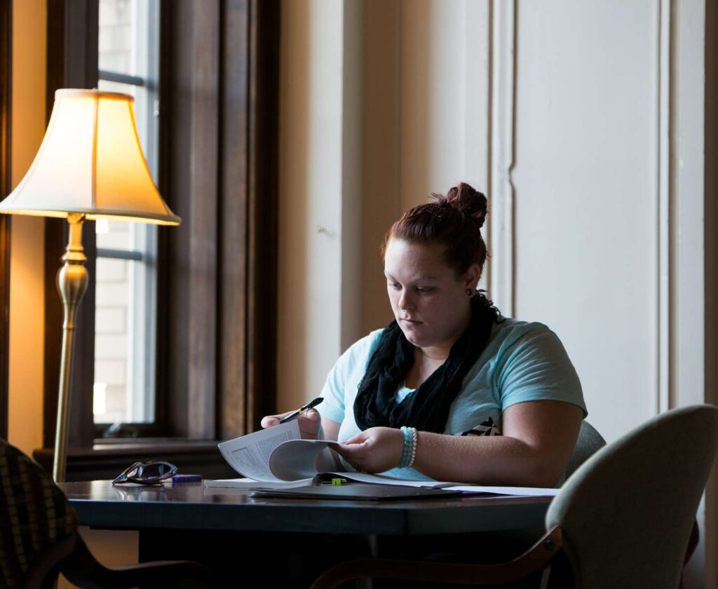 student studying in Le Fer Hall