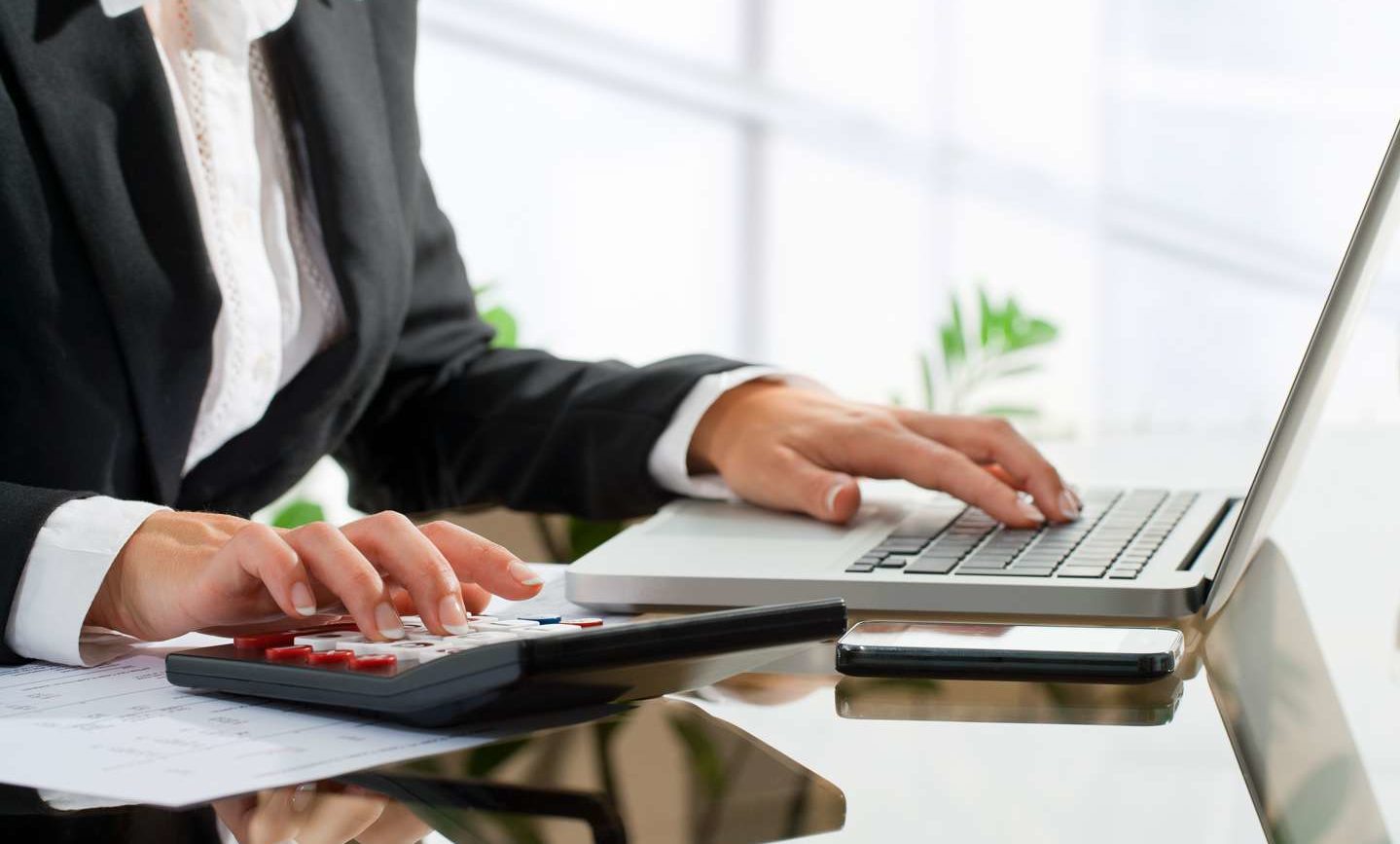 woman with calculator and keyboard